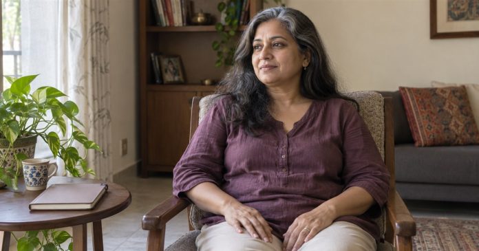 Woman sitting comfortably in an ordinary home chair with a notebook nearby
